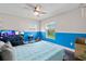 Cozy bedroom with two-tone walls and two windows providing natural light at 2306 S Valrico Rd, Valrico, FL 33596