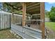 Well-maintained chicken coop in a spacious backyard, offering a charming and functional addition to the property at 2306 S Valrico Rd, Valrico, FL 33596
