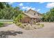 Lovely brick home with attached garage and mature landscaping in a circular driveway at 2306 S Valrico Rd, Valrico, FL 33596