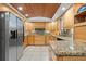 Well-equipped kitchen with granite countertops, custom cabinetry, and modern appliances at 2306 S Valrico Rd, Valrico, FL 33596