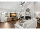 Inviting living room with hardwood floors, a cozy fireplace, and stylish decor at 2306 S Valrico Rd, Valrico, FL 33596