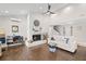 Bright and airy living space with a brick fireplace, hardwood floors, and comfortable seating at 2306 S Valrico Rd, Valrico, FL 33596