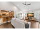 Comfortable living area adjacent to a modern kitchen with ample counter space and natural light at 2306 S Valrico Rd, Valrico, FL 33596