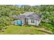 Screened-in pool in a backyard that includes a blue pool, grass area, and privacy fence at 2435 Fox Forest Dr, Lutz, FL 33549