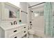 Bathroom featuring a modern vanity, framed mirror, and a shower with a tub for relaxation at 2435 Fox Forest Dr, Lutz, FL 33549