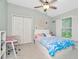 Bright bedroom with a vaulted ceiling, carpet, desk, and window at 2435 Fox Forest Dr, Lutz, FL 33549