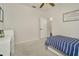 Bedroom featuring a blue striped bed, carpet and closet at 2435 Fox Forest Dr, Lutz, FL 33549