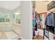 Open doorway leading to the bathroom and walk-in closet with built-in storage solutions at 2435 Fox Forest Dr, Lutz, FL 33549