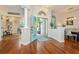 Welcoming foyer with hardwood floors and stylish accents leading to the study and dining room at 2435 Fox Forest Dr, Lutz, FL 33549
