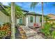 Charming home featuring a bright blue front door, lush landscaping and a welcoming walkway at 2435 Fox Forest Dr, Lutz, FL 33549