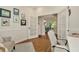 Bright home office with French doors, white wainscoting, and tile floors at 2435 Fox Forest Dr, Lutz, FL 33549