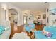 Bright living room featuring an open layout, hardwood floors, and stylish furniture at 2435 Fox Forest Dr, Lutz, FL 33549