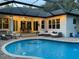 Inviting pool area with fountain feature and ambient lighting at 2435 Fox Forest Dr, Lutz, FL 33549