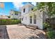 Charming backyard with brick patio, well-maintained landscaping, and a bright white home at 258 14Th Ne Ave, St Petersburg, FL 33701