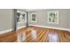 Bright bedroom with hardwood floors, neutral walls, and natural light from two large windows at 258 14Th Ne Ave, St Petersburg, FL 33701