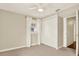 Bright bedroom with a ceiling fan, a large closet, and a window providing natural light at 258 14Th Ne Ave, St Petersburg, FL 33701