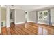 Bedroom with hardwood floors, a window with curtains, and entryways to other rooms at 258 14Th Ne Ave, St Petersburg, FL 33701