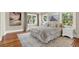 Comfortable bedroom features a plush king bed, neutral decor, and natural light from three windows at 258 14Th Ne Ave, St Petersburg, FL 33701