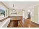 Bright dining room with hardwood floors, modern lighting, and built-in bench seating at 258 14Th Ne Ave, St Petersburg, FL 33701