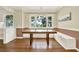Dining room with hardwood floors, natural light and built-in bench seating at 258 14Th Ne Ave, St Petersburg, FL 33701