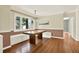 Dining room with hardwood floors, custom built-in seating, and large windows at 258 14Th Ne Ave, St Petersburg, FL 33701