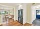View of the entryway and stainless steel refrigerator, adjacent to the dining room at 258 14Th Ne Ave, St Petersburg, FL 33701