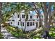 Beautiful two-story home featuring a green door and mature tropical landscaping at 258 14Th Ne Ave, St Petersburg, FL 33701