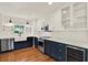 Modern kitchen featuring stainless steel appliances, navy cabinets, and a wine fridge at 258 14Th Ne Ave, St Petersburg, FL 33701