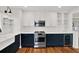 Stylish kitchen with stainless appliances, white subway tile, and two-tone cabinets at 258 14Th Ne Ave, St Petersburg, FL 33701