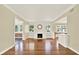 Spacious living room featuring hardwood floors and a charming fireplace at 258 14Th Ne Ave, St Petersburg, FL 33701