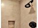 Tiled shower stall with a shower head and a built-in shelf at 258 14Th Ne Ave, St Petersburg, FL 33701