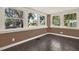 Inviting sunroom with large windows offering plenty of natural light and dark tile flooring at 258 14Th Ne Ave, St Petersburg, FL 33701