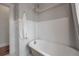 Clean bathroom featuring a classic clawfoot tub and tiled floors at 318 W Haya St, Tampa, FL 33603