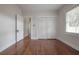 Bright bedroom features hardwood floors, closet, and a window with natural light at 318 W Haya St, Tampa, FL 33603