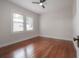 This is a bedroom with hardwood floors and lots of natural light at 318 W Haya St, Tampa, FL 33603