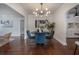 Chic dining room with hardwood floors, a stylish light fixture, and a view into the kitchen at 318 W Haya St, Tampa, FL 33603