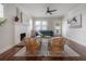 Cozy living room with a fireplace, hardwood floors, and large windows offering plenty of natural light at 318 W Haya St, Tampa, FL 33603