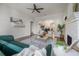 Open living room with a view into the dining area, featuring hardwood floors and a bright, airy atmosphere at 318 W Haya St, Tampa, FL 33603