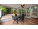 Enclosed patio with outdoor table and view of brick courtyard with tropical landscaping at 318 W Haya St, Tampa, FL 33603