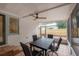 Inviting screened porch with ceiling fan and tile flooring for outdoor relaxation and dining at 318 W Haya St, Tampa, FL 33603
