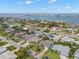 Aerial view of neighborhood homes in a waterfront community on a sunny day at 338 7Th N Ave, Tierra Verde, FL 33715