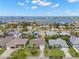 Aerial view showcasing the waterfront neighborhood, lush landscaping and a sparkling swimming pool at 338 7Th N Ave, Tierra Verde, FL 33715