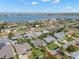 Panoramic aerial view of neighborhood homes showcasing waterfront and tree lined streets at 338 7Th N Ave, Tierra Verde, FL 33715