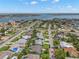 Bird's eye view of neighborhood homes with lush lawns and community waterfront access at 338 7Th N Ave, Tierra Verde, FL 33715