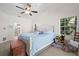 Comfortable bedroom features a bed, window, and rocking chair, creating a relaxing atmosphere at 338 7Th N Ave, Tierra Verde, FL 33715