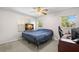 Bedroom featuring carpet floors, two windows, and a ceiling fan at 338 7Th N Ave, Tierra Verde, FL 33715