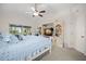 Cozy bedroom features comfortable bed, TV, and an entertainment center for storage at 338 7Th N Ave, Tierra Verde, FL 33715