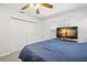 Bedroom highlighting a closet, ceiling fan, and a window overlooking the neighborhood at 338 7Th N Ave, Tierra Verde, FL 33715