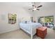 Bright bedroom features a bed, windows, and a sliding door, with access to the outdoors at 338 7Th N Ave, Tierra Verde, FL 33715