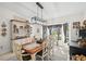 Bright dining room features stylish light fixture and a decorative hutch for storing dinnerware at 338 7Th N Ave, Tierra Verde, FL 33715